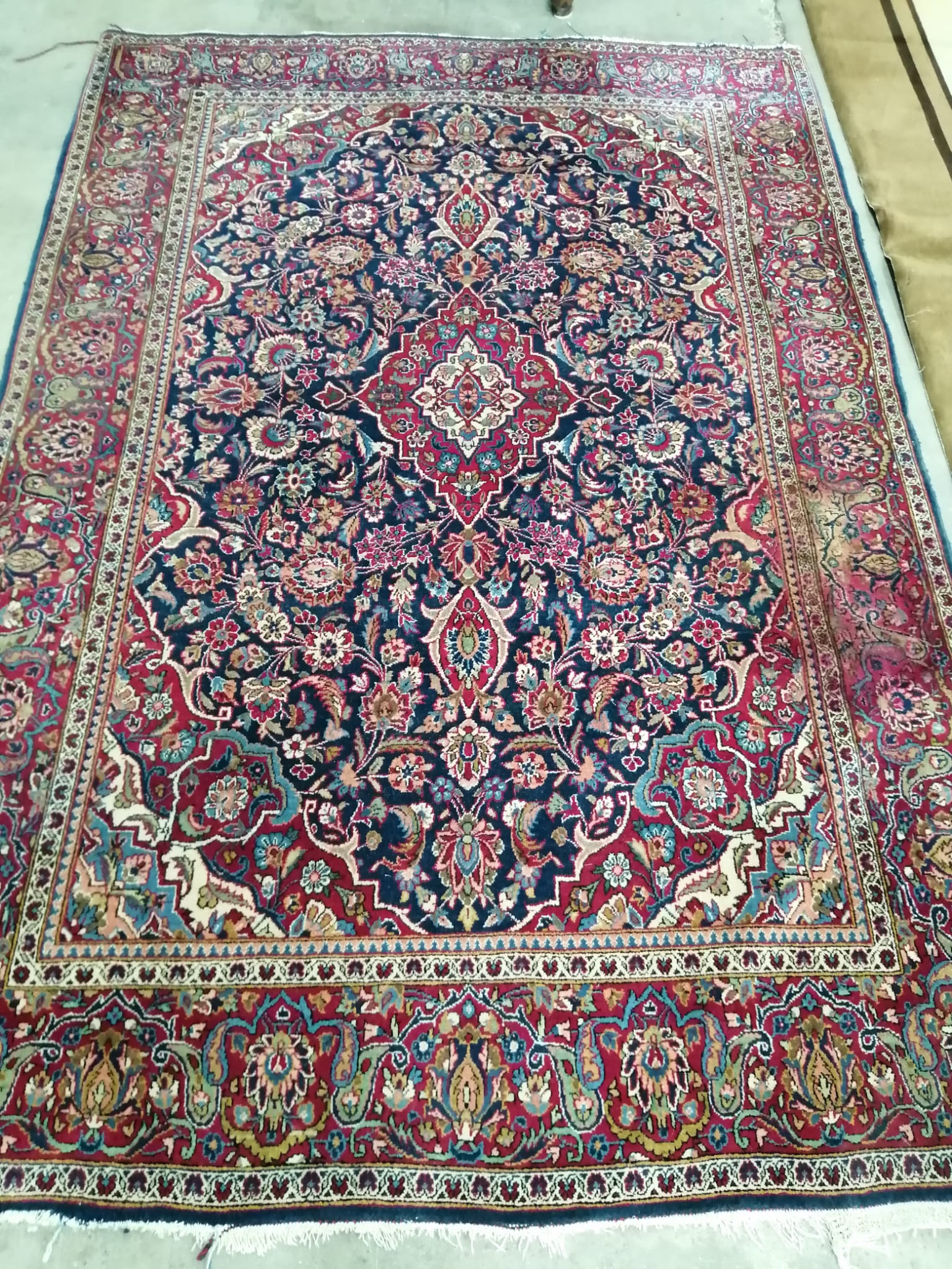 An Isphahan burgundy ground rug, 206 x 140cm